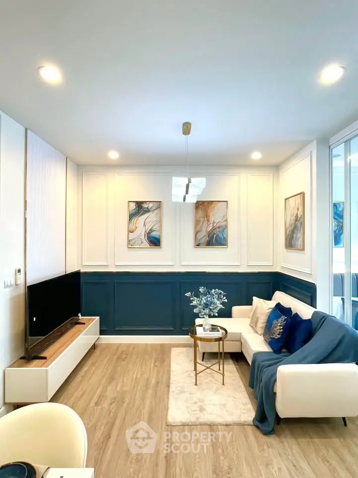 Stylish modern living room with elegant decor and cozy seating area.