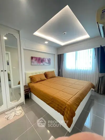 Modern bedroom with stylish ceiling lights and large window for natural light.