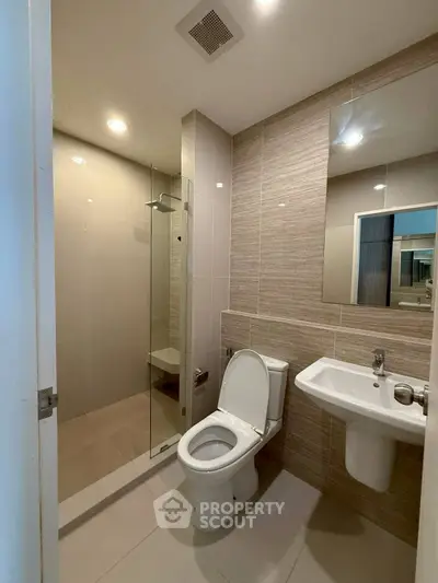 Modern bathroom with sleek design and glass shower enclosure