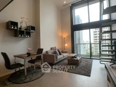 Modern loft-style living room with high ceilings and city view, featuring sleek furniture and large windows.