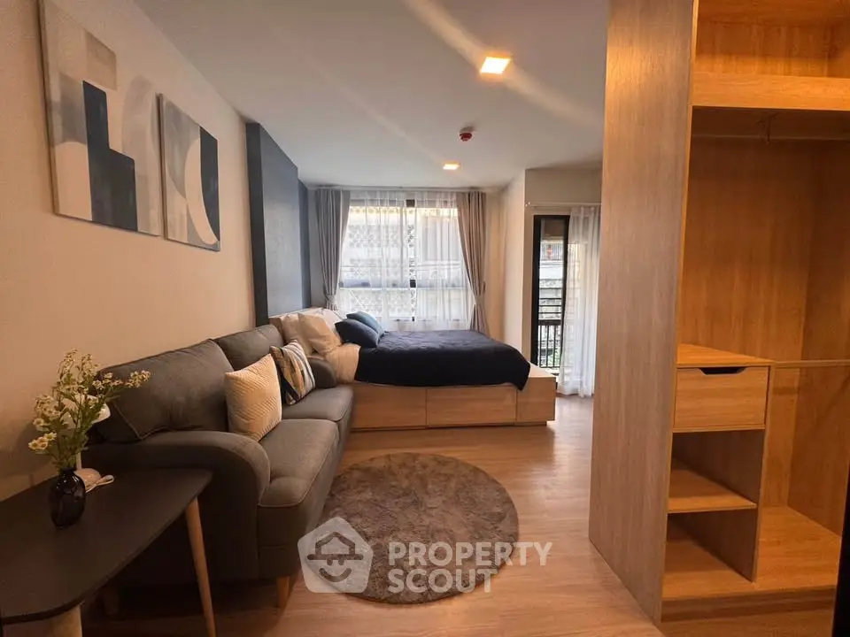Modern studio apartment with cozy living area and stylish decor