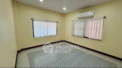 Spacious empty room with air conditioning and large windows, perfect for customization.