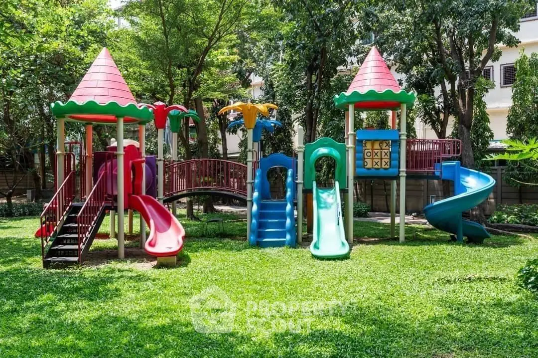 Vibrant playground in lush garden setting, perfect for family-friendly living.