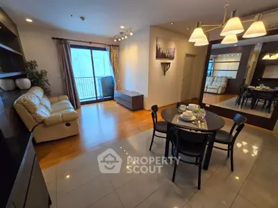 Spacious living room with elegant dining area and balcony access in modern apartment.