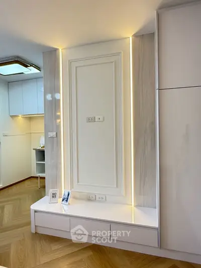 Modern living room with elegant wall paneling and ambient lighting