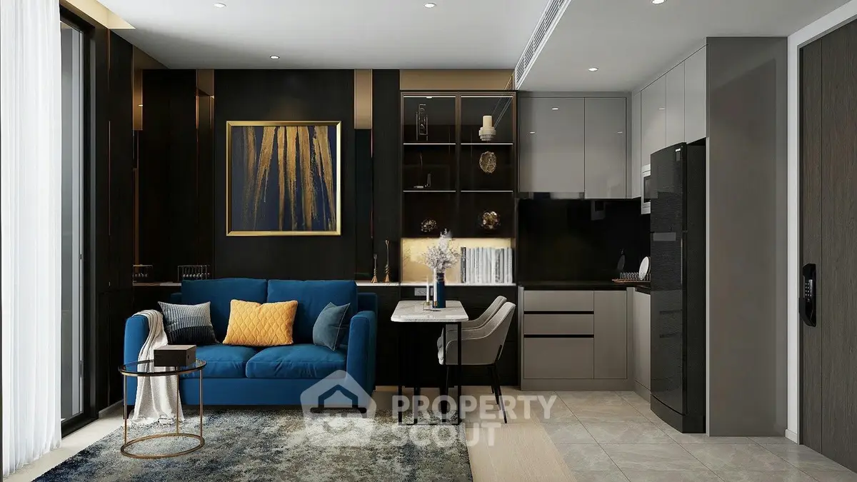 Modern living room with stylish decor and open kitchen layout, featuring a blue sofa and elegant furnishings.