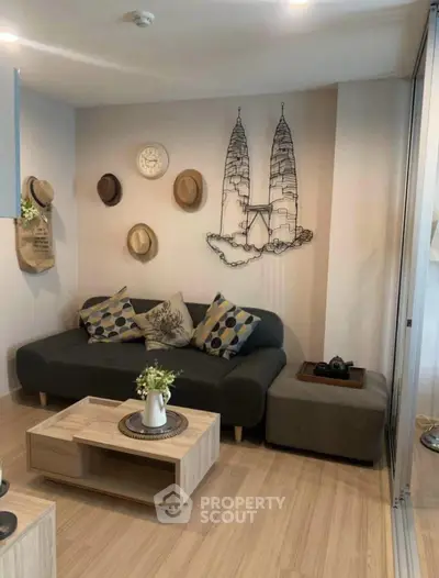 Stylish living room with modern decor and cozy seating area, perfect for relaxation.