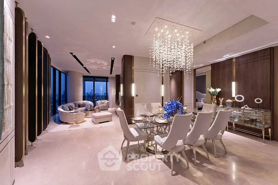 Luxurious open-plan living and dining area with elegant chandelier and city view.