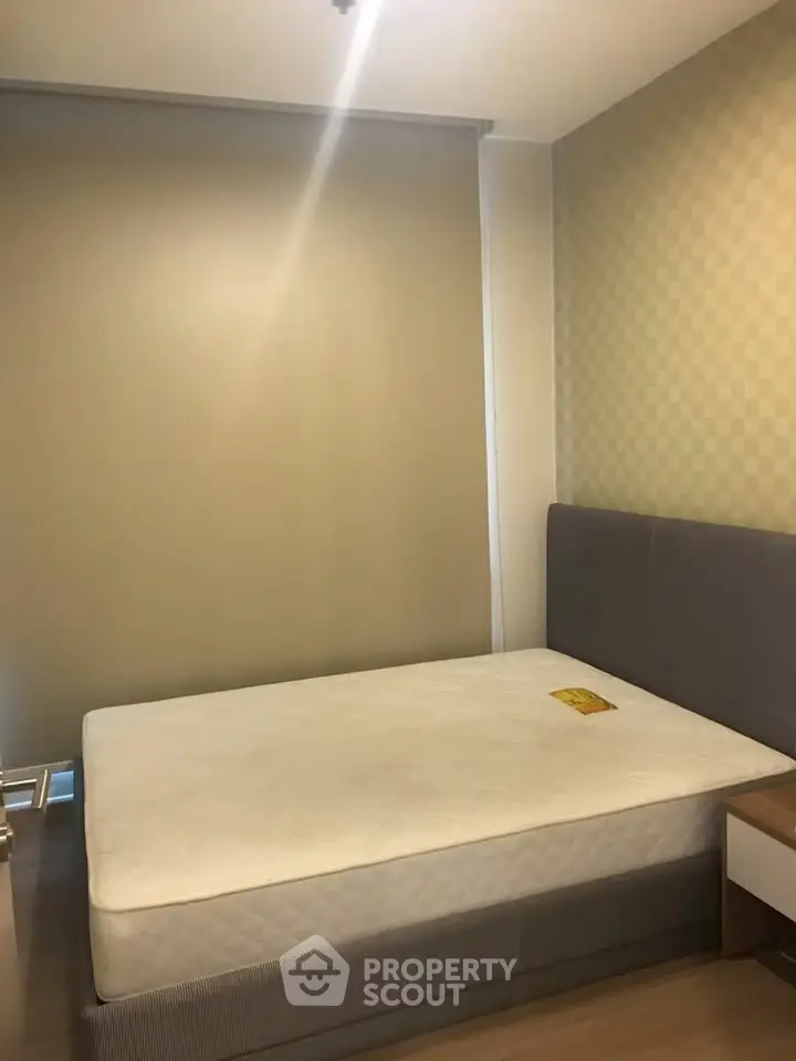 Cozy bedroom with modern design and comfortable bed in a stylish apartment.