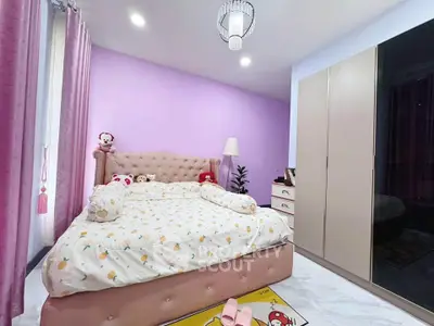 Charming bedroom with plush bed and elegant decor in modern apartment