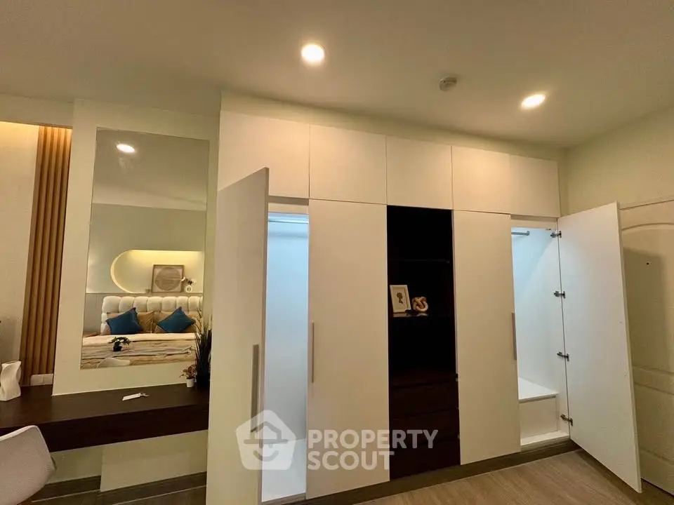 Modern bedroom with open wardrobe and stylish decor