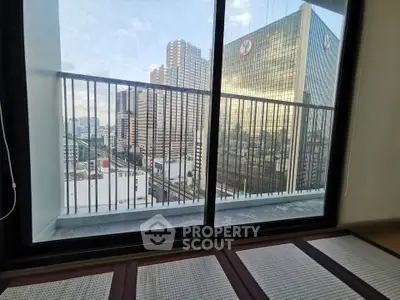 Stunning city view from a modern apartment balcony with sleek railing design.