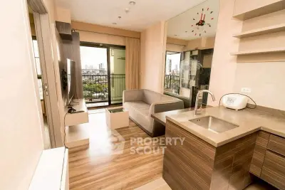 Modern living room with city view, open layout, and sleek kitchen design in urban apartment.