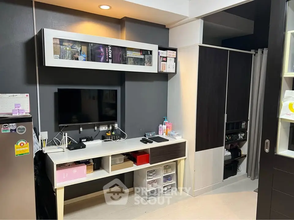 Modern study area with sleek storage and entertainment setup