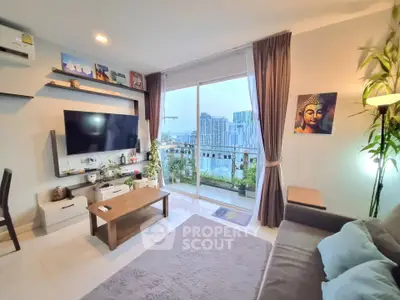 Modern living room with large window offering stunning city view, stylish decor, and cozy ambiance.