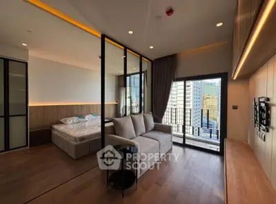 Modern studio apartment with large windows and city view