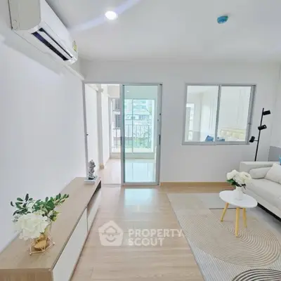 Modern living room with air conditioning and stylish decor in a bright apartment.