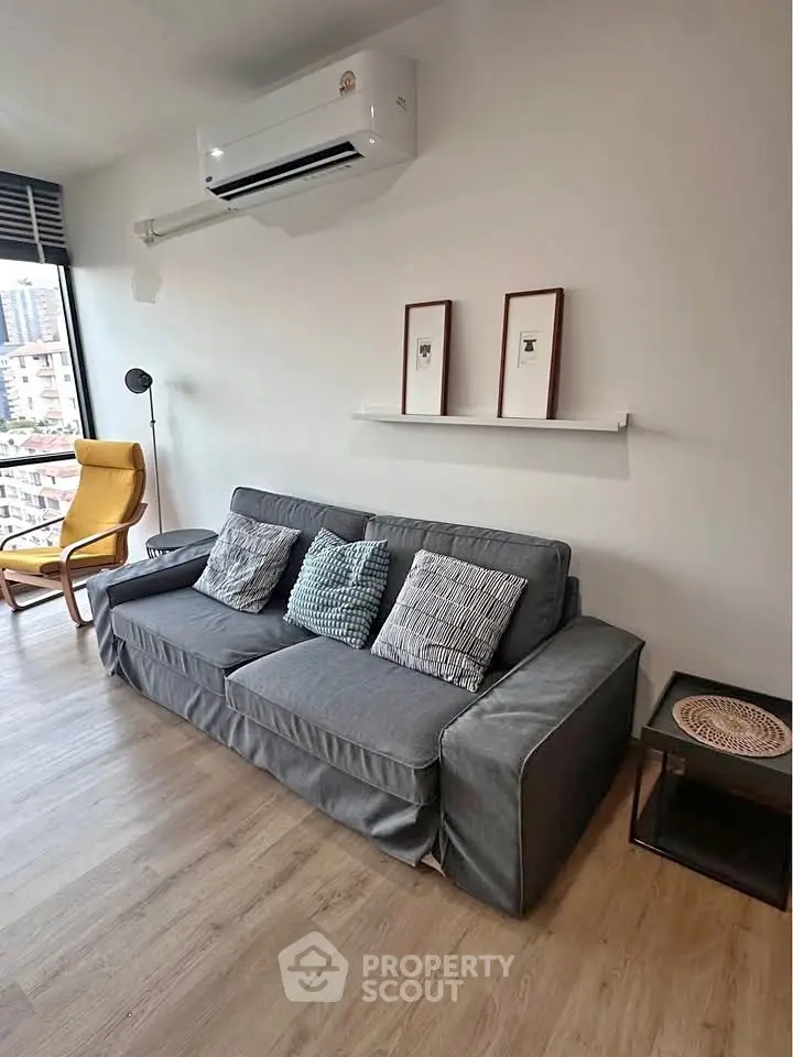 Modern living room with stylish sofa and city view window