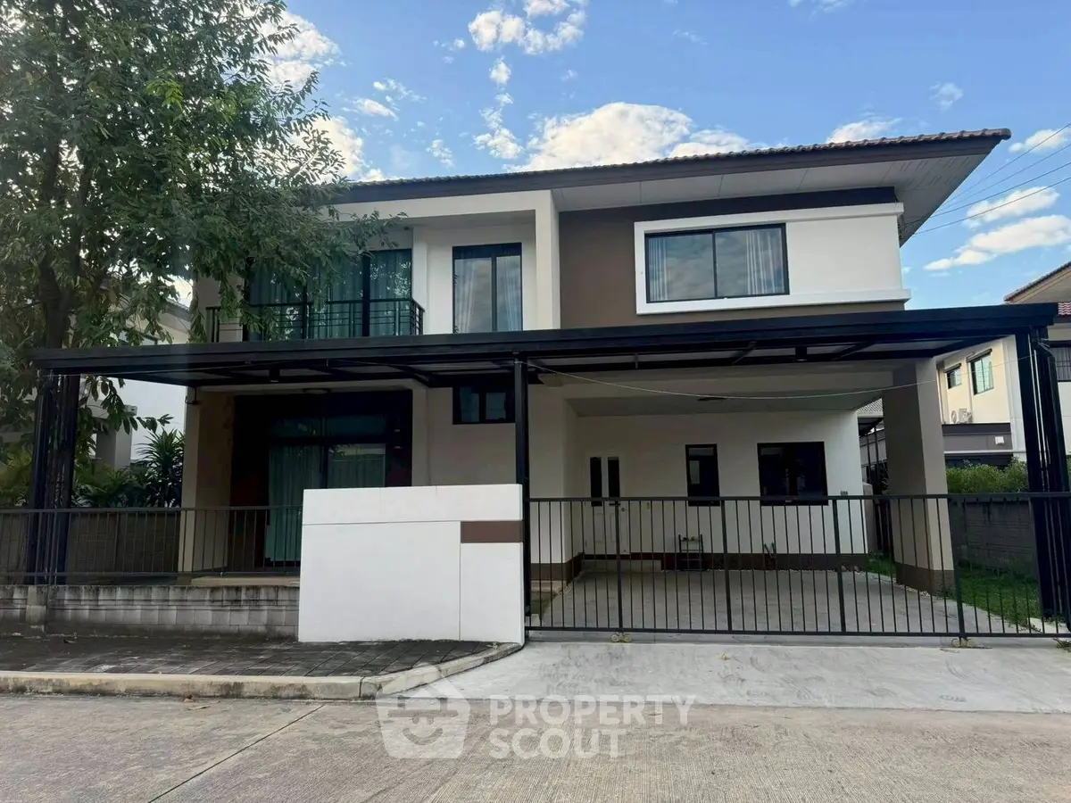 Modern two-story house with spacious driveway and contemporary design