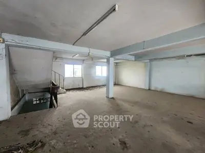 Spacious unfinished interior with potential for customization in a versatile real estate property.