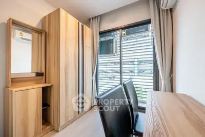 Modern study room with wooden furniture and large window in a stylish apartment.