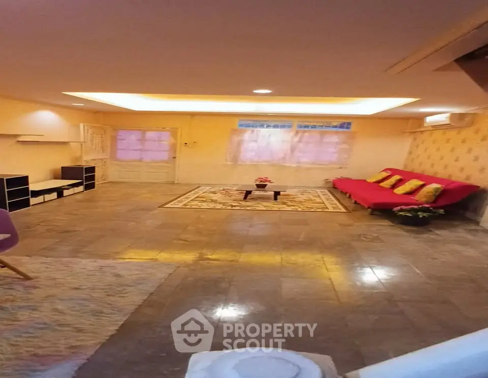 Spacious living room with modern decor and cozy seating area