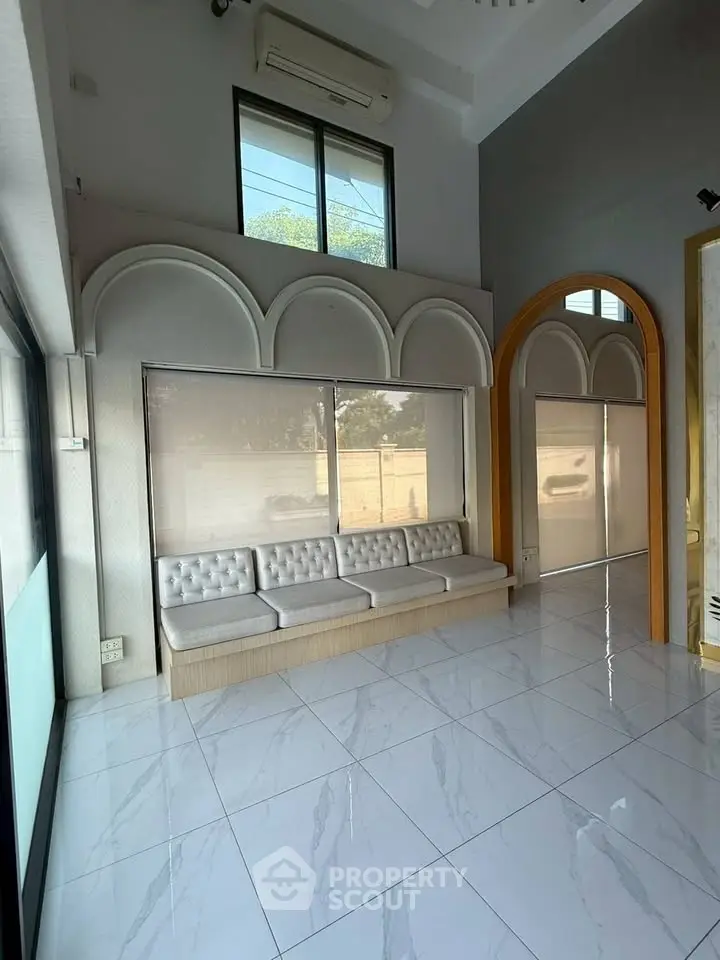 Spacious modern living room with high ceilings and elegant design