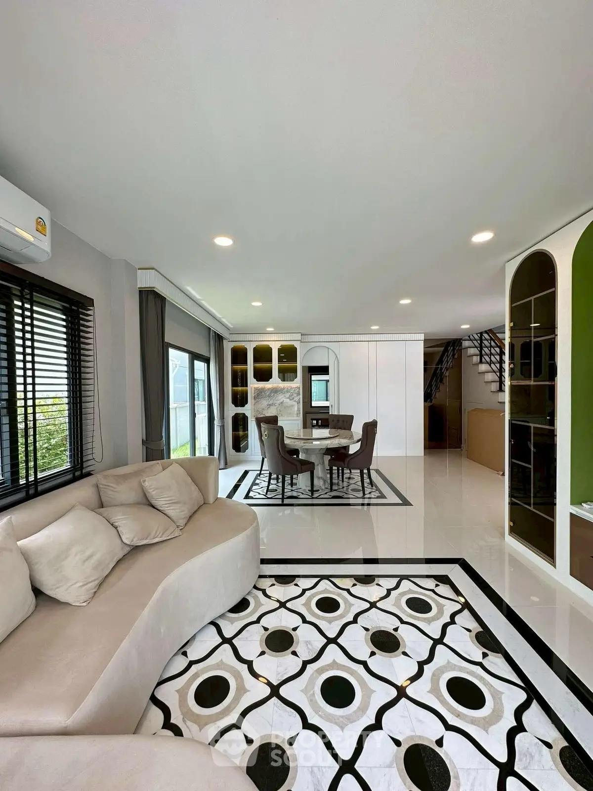 Luxurious open-plan living room with elegant decor and modern furniture, perfect for stylish living.