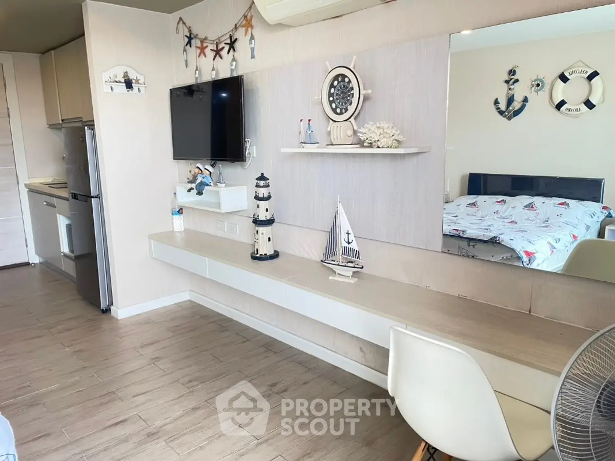 Coastal-themed living space with nautical decor and modern furnishings.