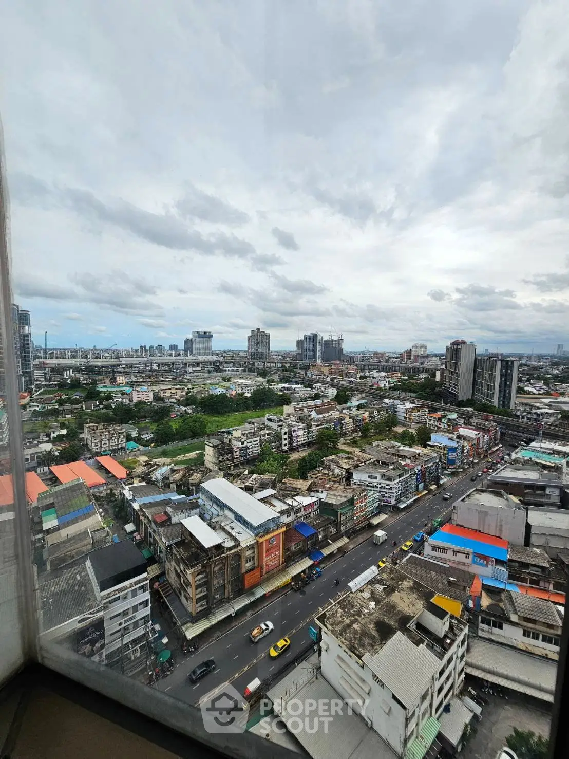 Stunning cityscape view from high-rise building showcasing urban skyline and vibrant city life.
