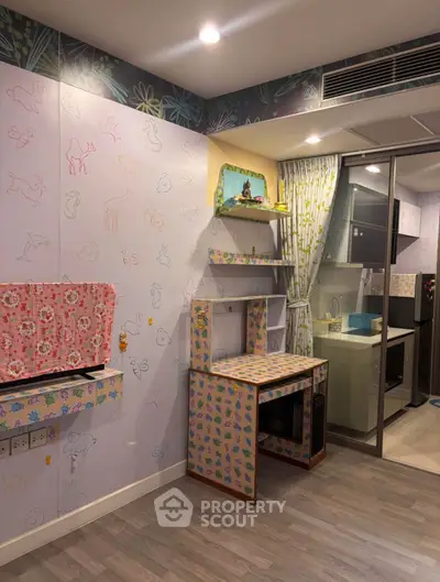 Charming kitchen with colorful decor and modern appliances in a cozy apartment setting.