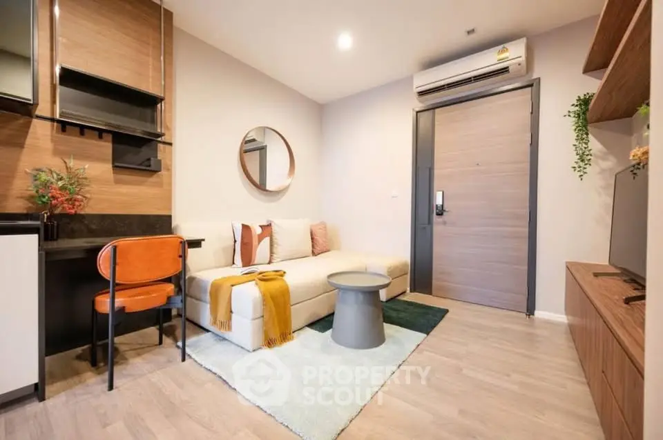 Modern living room with stylish decor and cozy seating in a contemporary apartment.