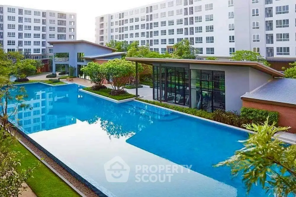 Luxurious condominium with stunning pool and modern architecture.