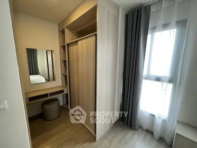 Modern bedroom with built-in wardrobe and vanity in a bright apartment