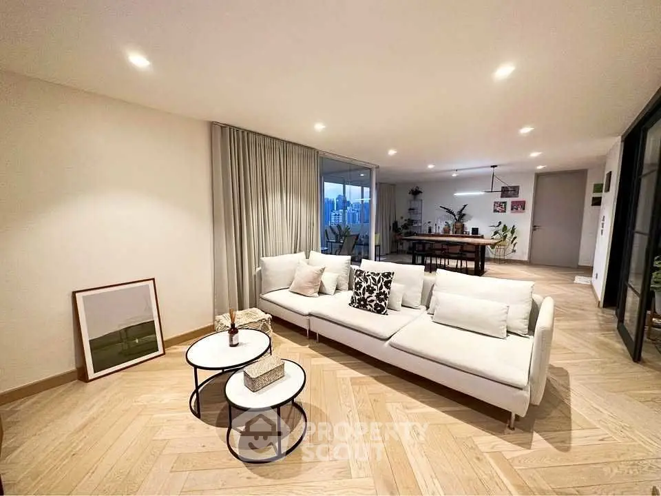 Spacious modern living room with elegant decor and open layout, perfect for entertaining.
