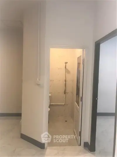 Minimalist bathroom with shower in modern apartment