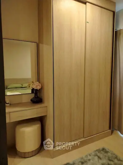 Cozy bedroom corner with built-in wardrobe and vanity area