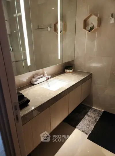 Luxurious modern bathroom with sleek vanity and ambient lighting