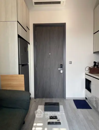 Modern apartment interior with sleek kitchen and cozy living area