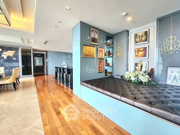 Luxurious open-plan living area with elegant decor and hardwood floors