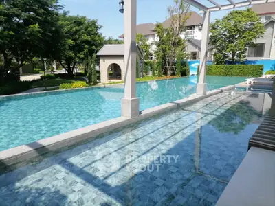Luxurious residential pool with serene surroundings and modern architecture.