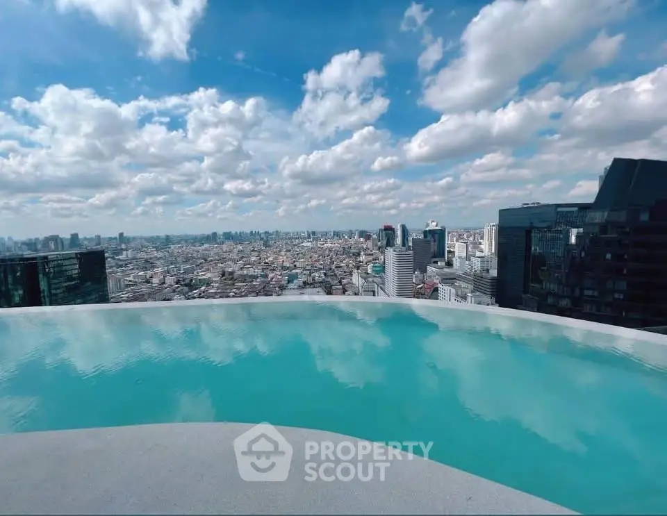 Stunning rooftop infinity pool with breathtaking city skyline views.