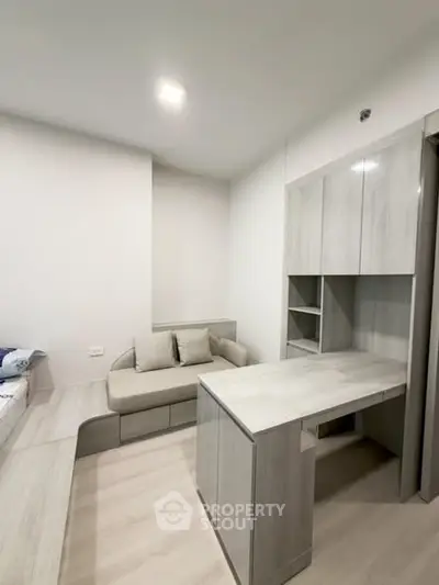 Modern minimalist living room with sleek furniture and neutral tones