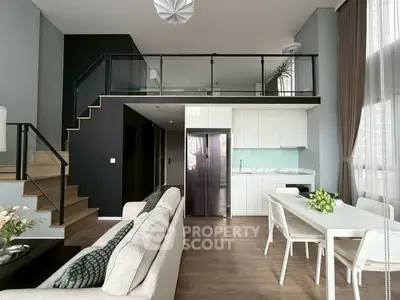 Modern duplex living room with open kitchen and stylish decor