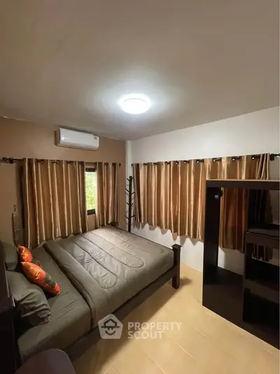 Cozy bedroom with elegant curtains and modern furnishings