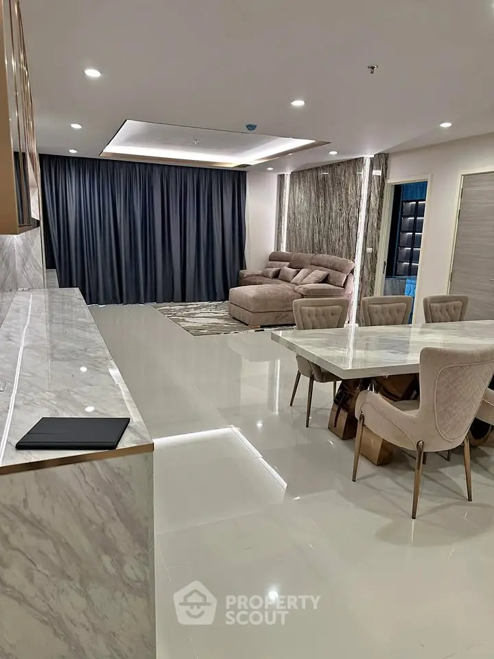 Luxurious modern living room with elegant marble flooring and stylish furniture, perfect for sophisticated living.