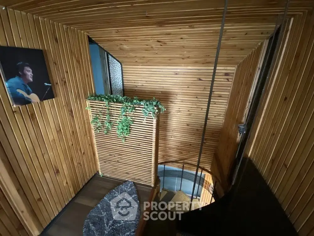 Charming wooden staircase with unique design and greenery accents