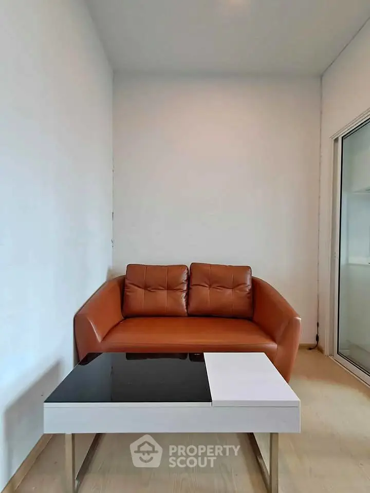 Modern living room with stylish brown sofa and sleek coffee table