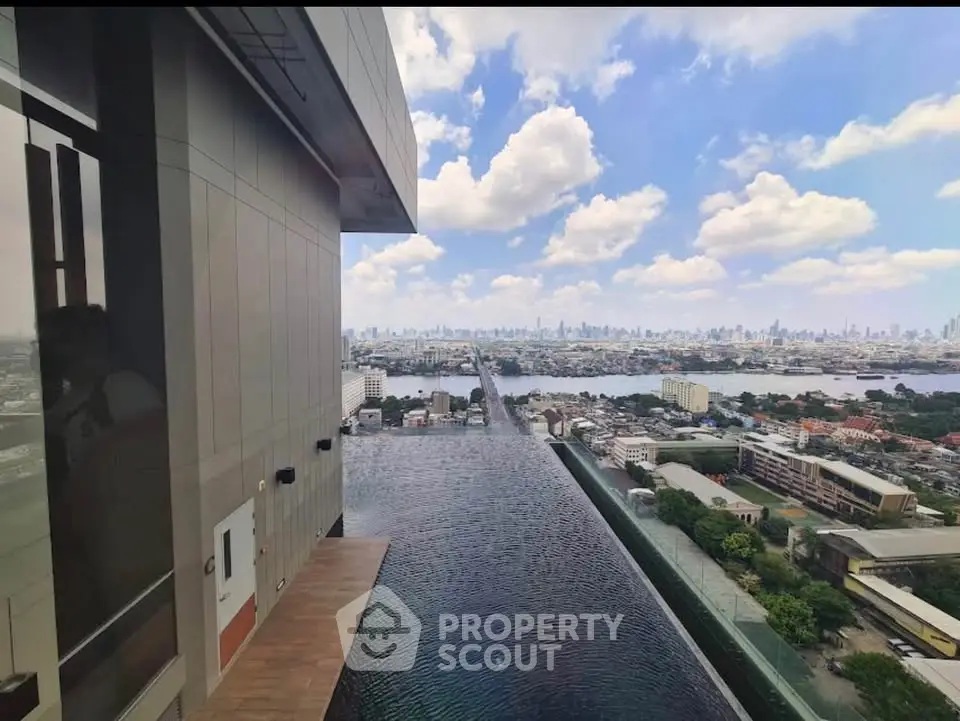 Stunning rooftop infinity pool with breathtaking city skyline view