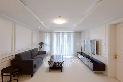 Spacious living room with modern furniture and large windows